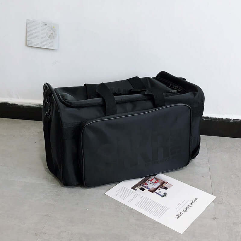 Ultimate Sports Bag for Athletes- Organize your Gear displayed on the floor with a magazine beside it.